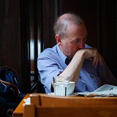 Photo of a man reading in a cafe in Dublin, Ireland